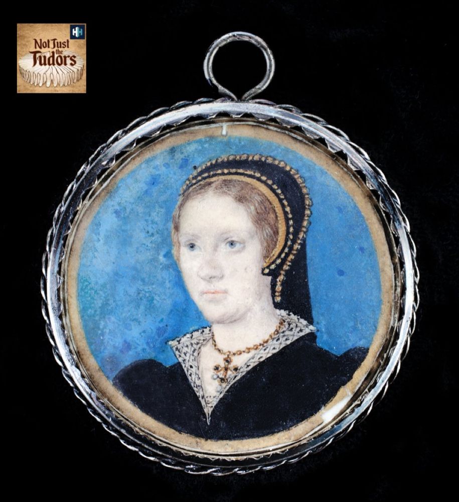 A sixteenth-century miniature of woman with auburn, centrally-parted hair wears a black, bejewelled French hood, and a black gown with a blackworked (embroidered) collar, and cross pendant of jewels. Her eyes and the background are blue. 