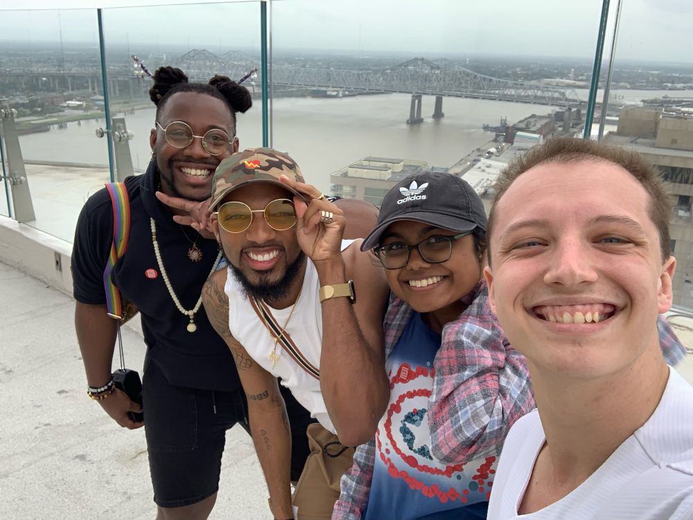 Me and 3 friends with New Orleans in the background.