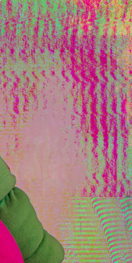Close up of a datamoshed photo. There are grainy, gritty bright pink and green striped patterns on the right side of the image.