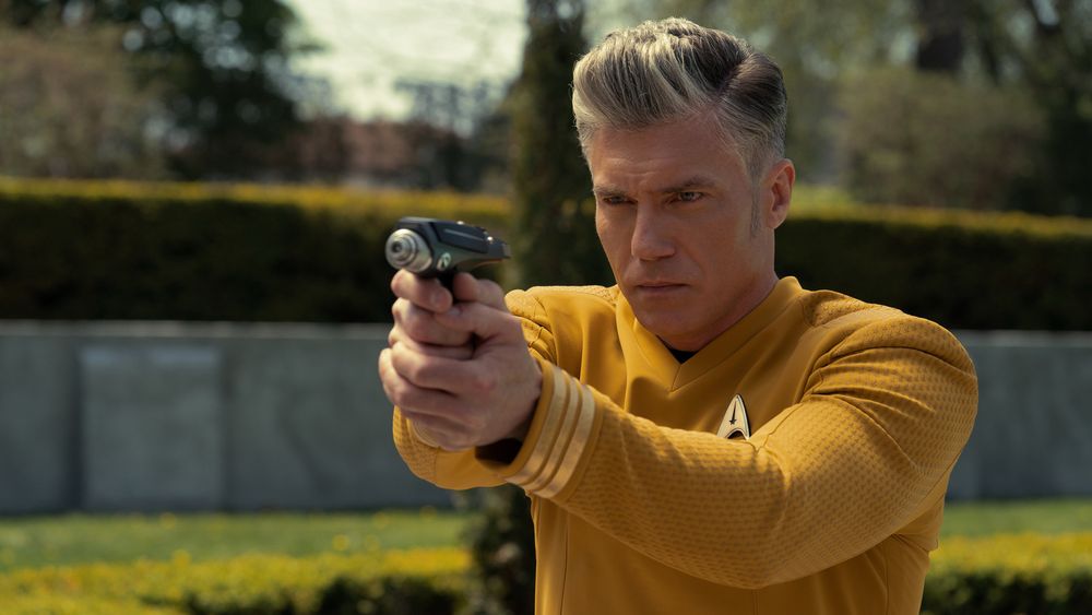 Captain Christopher Pike aiming a Phaser, from Star Trek. 
