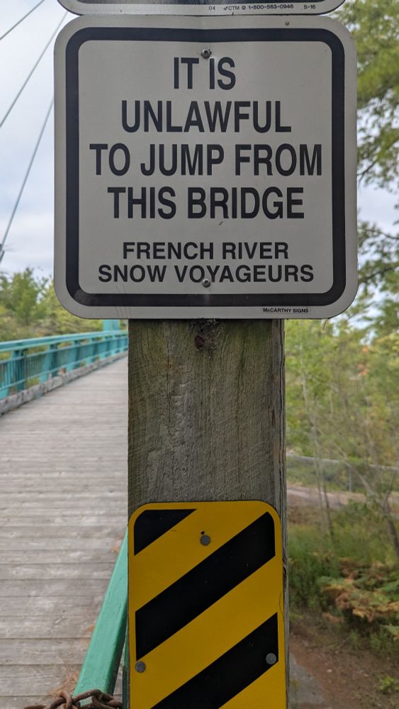 IT IS UNLAWFUL TO JUMP FROM THIS BRIDGE 

FRENCH RIVER SNOW VOYAGEURS