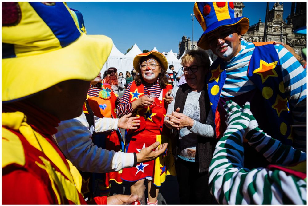 Clowns at Mexico City’s Zocalo offering hugs and joy to strangers from all walks of life. 