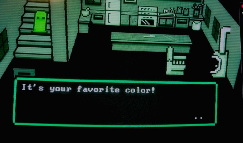 A fully green 3D pixel kitchen with a lime green character on the stairs. Text prompt that says “It’s your favourite colour!”