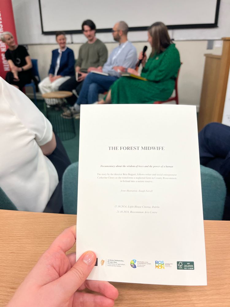 A folder about the event being held in front of the panel.