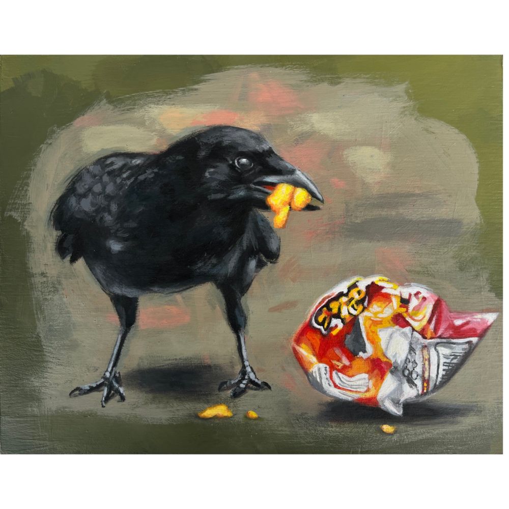 A crow eating someone's leftover cheese curls snack out of a crumpled bag