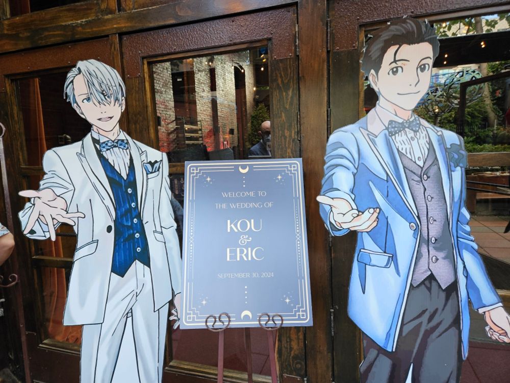 Welcome sign for Kou & Eric's wedding, flanked by standees of Victor and Yuri from Yuri On Ice