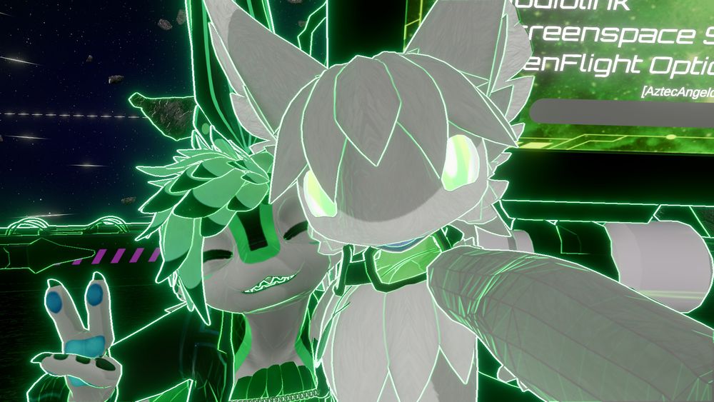 Najdorf taking a selfie with Atri leaning on his right shoulder (with green lighting effects).