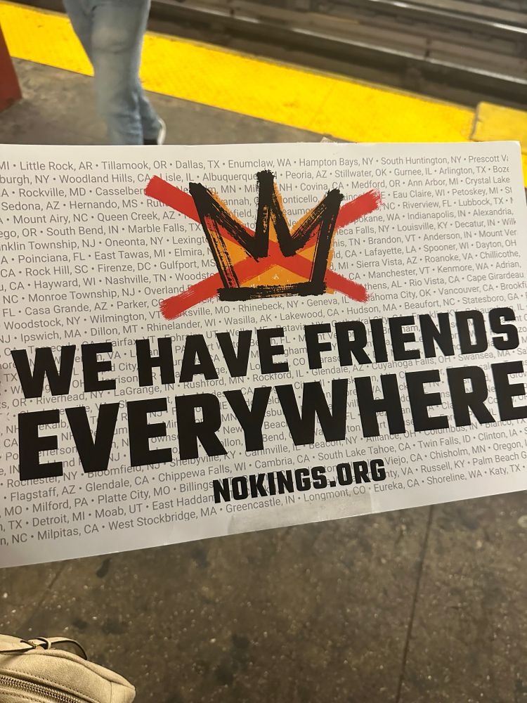 a sign from a No Kings rally that reads “We Have Friend Everywhere” 