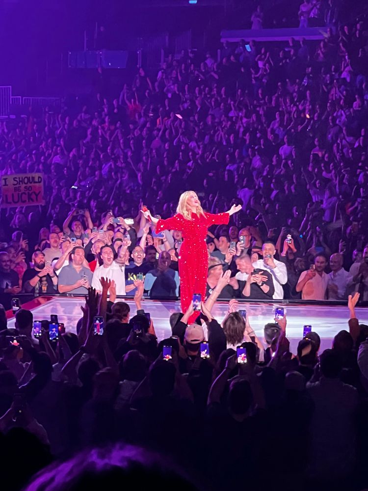 Kylie with her arms outstretched 