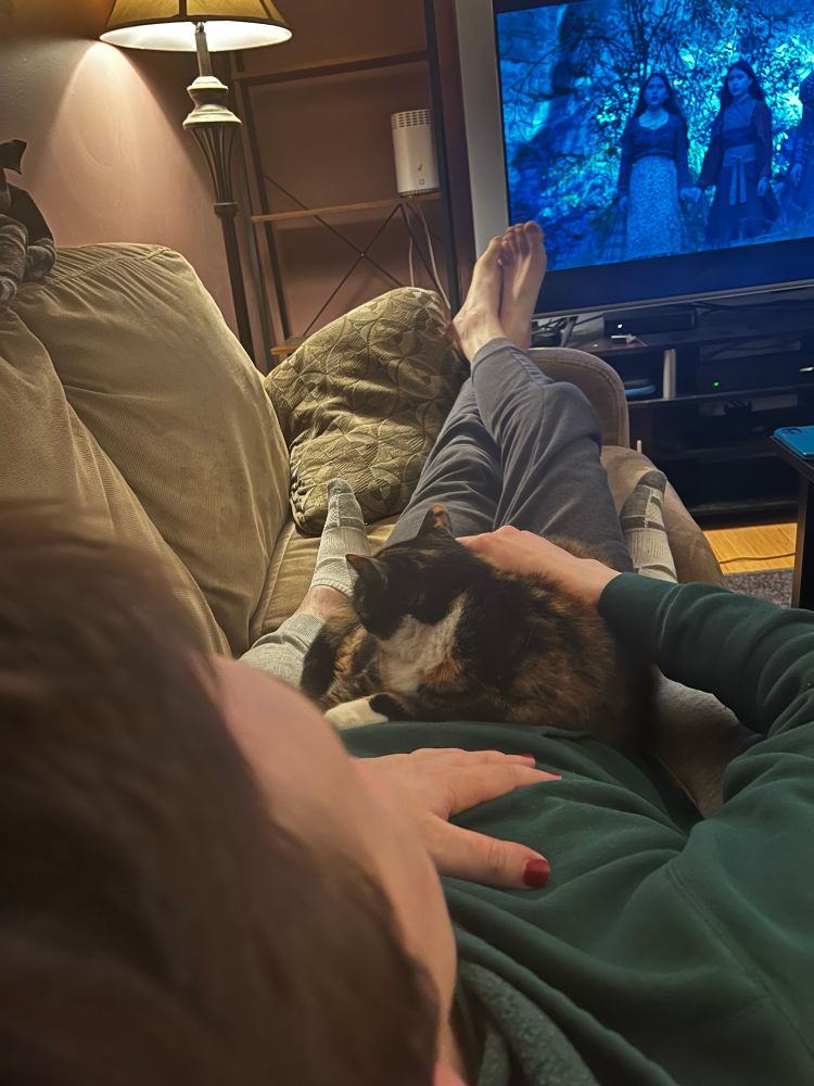 Selfie of boyfriend with a calico cat in his lap