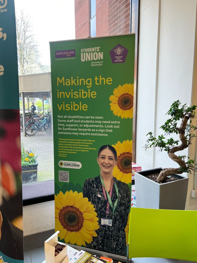 photo showing Making the Invisible Visible poster on university of Mcr campus.