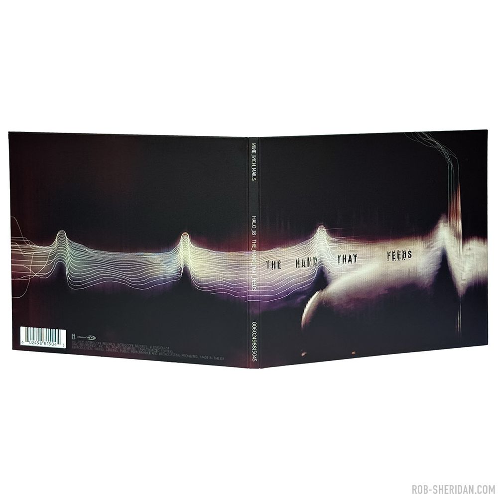 Photo of the exterior of Nine Inch Nails “The Hand That Feeds” CD single package, released March 2005. Cover/interior artwork created by Rob Sheridan with damaged scanner glitching techniques and hand-drawn digital pixel linework. The digital lines that ran throughout the NIN “With Teeth” aesthetic were inspired by (and sometimes taken directly from) low-res scientific graphs and data imagery. In this case I drew them tracing the topography of the textural element, attempting to quantify it, seeking meaning in its form: at once a strange landscape, distant mountains, a seismogram, an electrocardiogram, a cloud nebula… And of course I had Joy Division’s iconic “Unknown Pleasures” album cover in mind as I was making this.