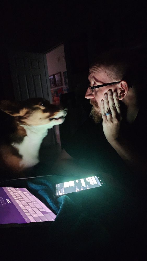 Chloe corgi and my son "talking" 
