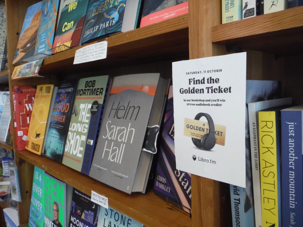 Pic of poster on bookshelf with new hardbacks: "Saturday 11 October: Find the Golden Ticket"
#ChrisBarkley #SarahHall #BobMortimer etc.