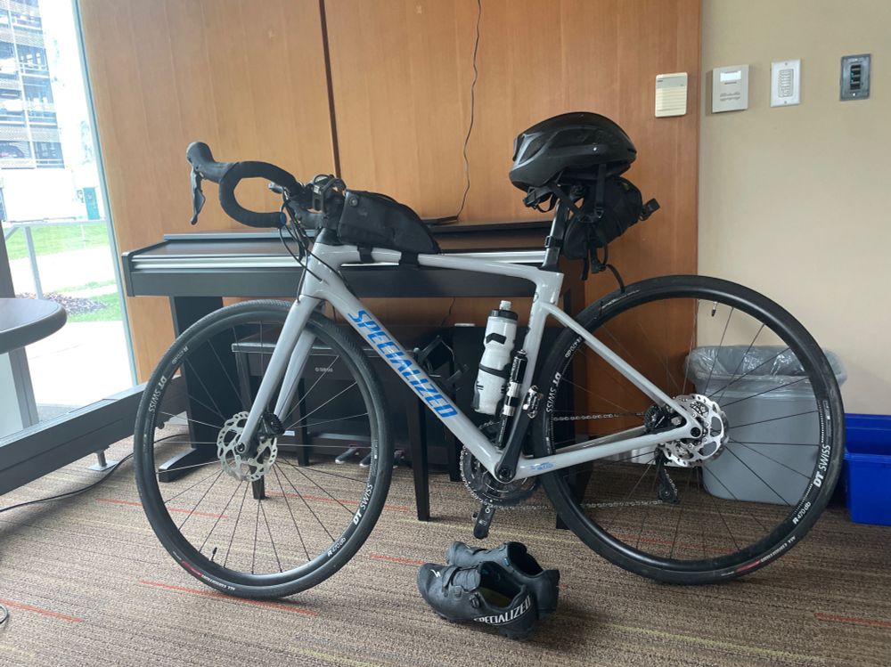 Grey bicycle testing on a piano