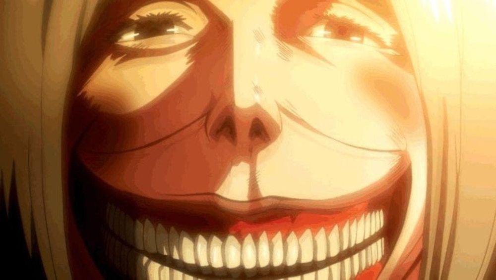 The Smiling Titan from the Attack on Titan anime with its terrifyingly wide and toothy grin plus stylish blonde bob haircut