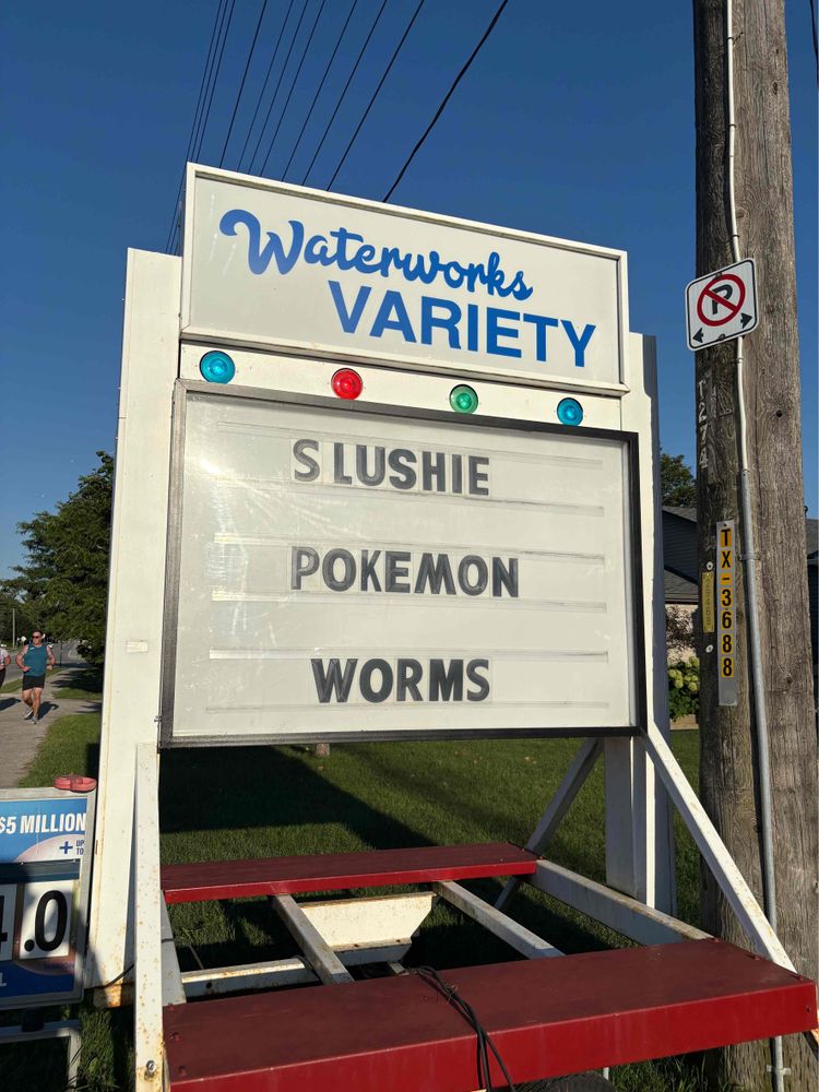 Sign in front of Waterworks Variety store: SLUSHIE POKEMON WORMS