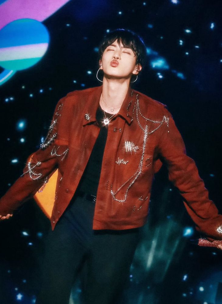 Jin of BTS on his Run Seokjin Tour in Seoul. He is making a kissy face with his eyes closed like the cutest bean ever and he is so sparkly 