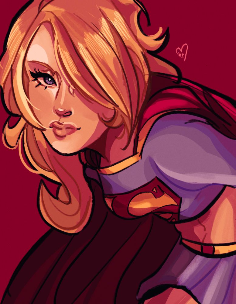 supergirl in her 2005 crop top and miniskirt costume. she’s leaning towards the camera with a bang covering her eye. 