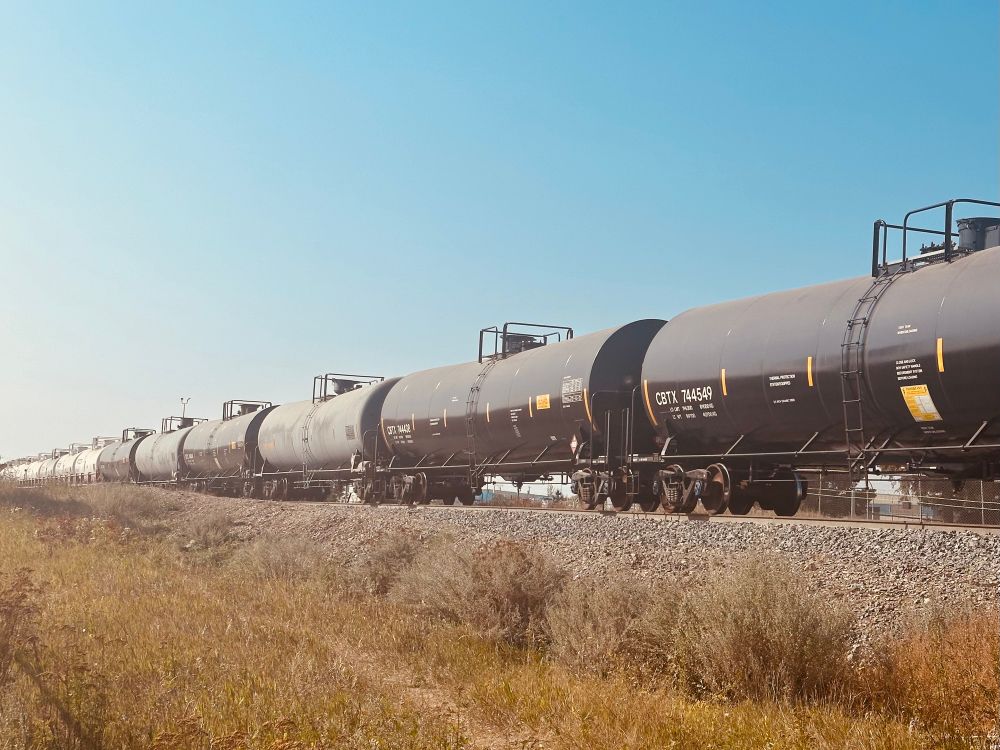 Train cars stopped on the track stretching into the distance