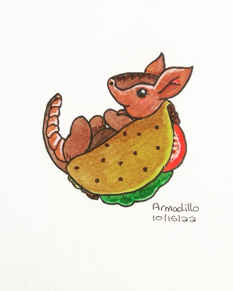Ink drawing of an armadillo with a taco shell instead of their own shell. Taco is a hard crunchy shell type and you can see ground beef, lettuce, and tomato inside. The armadillo is lying on its back with its feet and tail in the air. It’s hand drawn and coloured in with ink markers. 