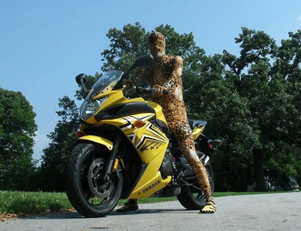 A picture of me in a zentai suit sitting on my motorcycle