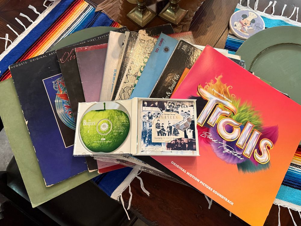 Photo of random albums and a Beatles CD