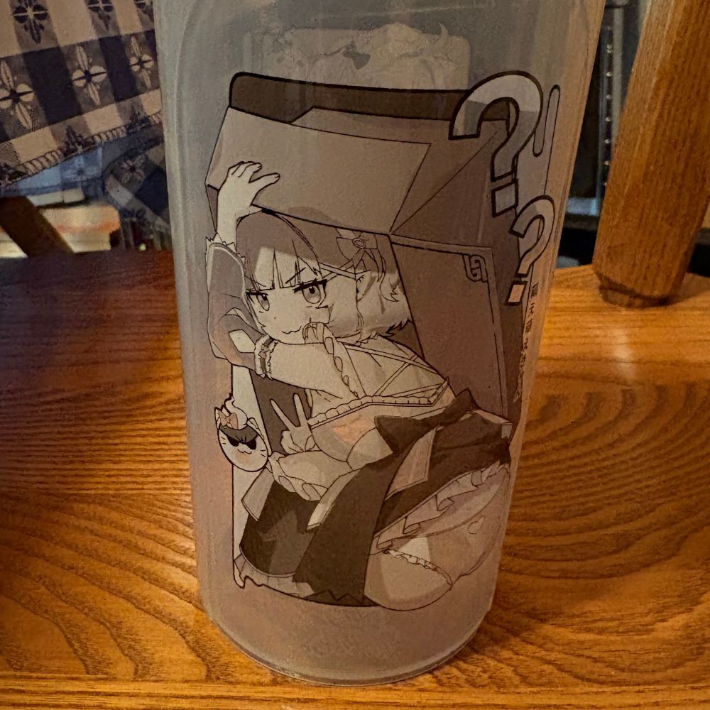 back of gamersupps cup of maid mint, she is hiding in a box like solid snake with her underwear exposed