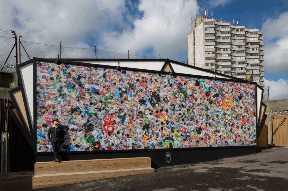 One Earth's May 'Visual Earth' piece features a mural by artist Daniel Webb. The piece is entitled Everyday Plastic, and exhibits every single piece of plastic Webb used in 2017. This mural of 2,280 liters of plastics among 4,490 items, currently installed at Dreamland in Margate, illuminates the overproduction and overconsumption of the epidemic plastic products.