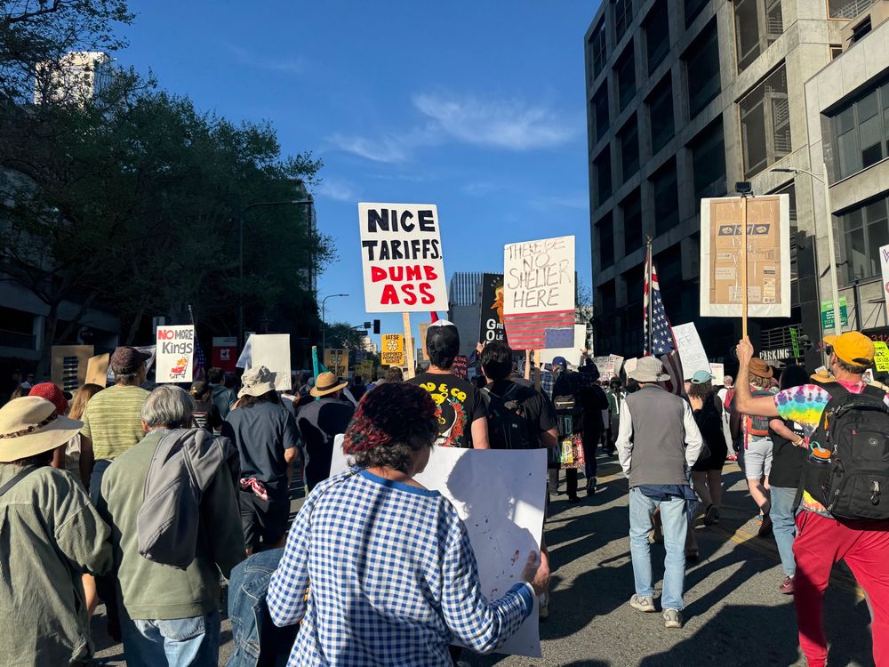 People marching on Hill Street in LA