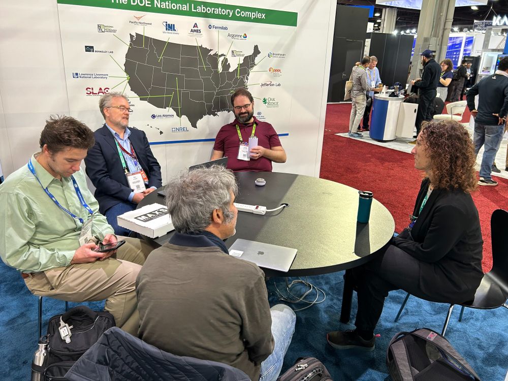 Berkeley Lab researchers have a discussion at a round table