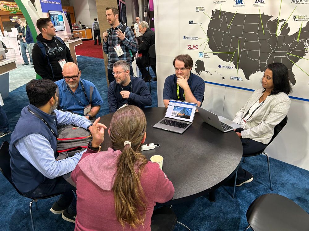 Berkeley Lab researchers having a discussion at a round table
