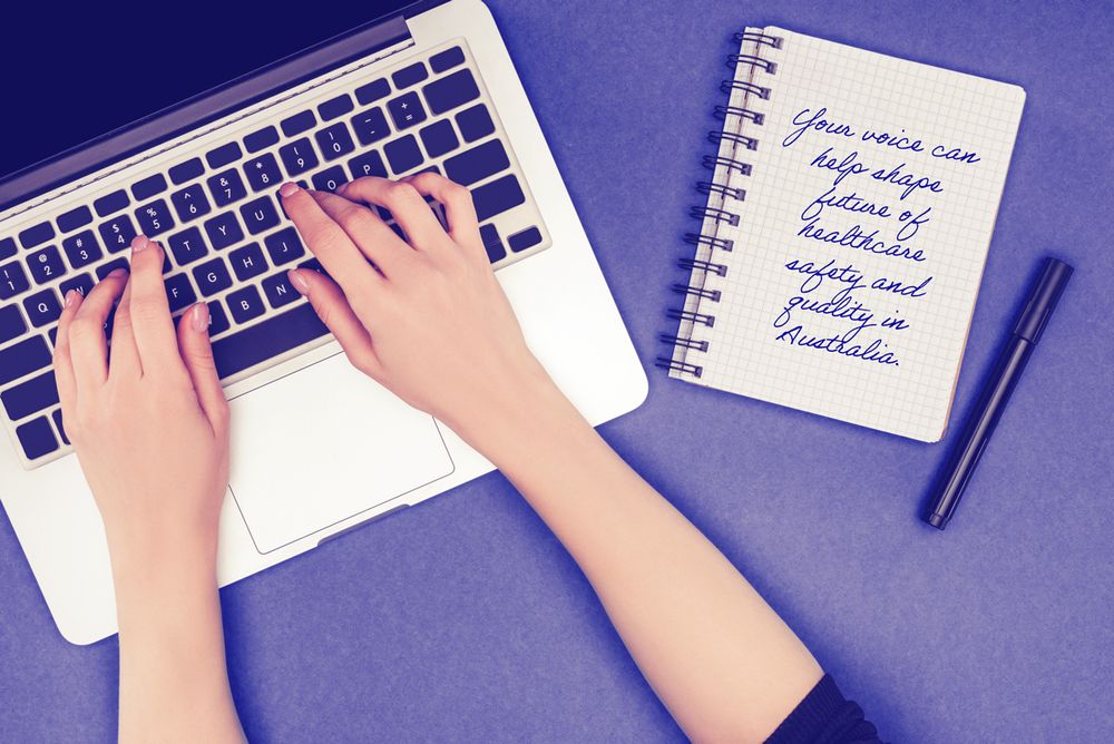 Person using laptop, notebook which reads "Your voice can help shape the future of healthcare safety and quality in Australia"