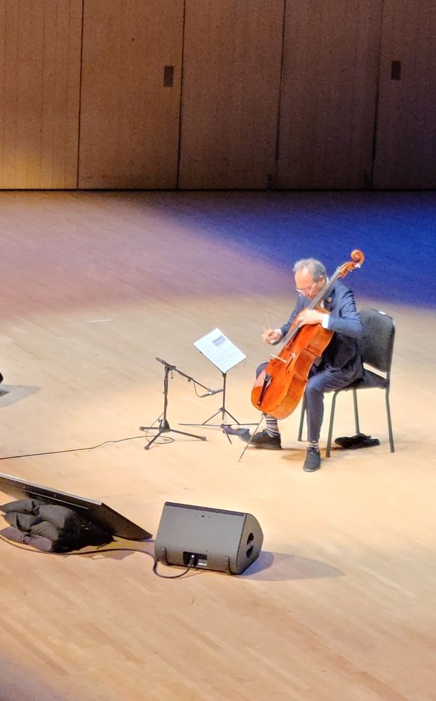 Yo-Yo Ma playing the cello on stage.
