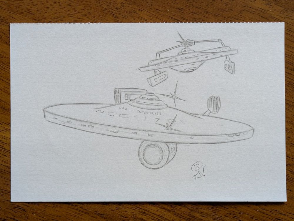 A photograph of a black and white pencil sketch showing a scene from Star Trek II: The Wrath Khan where the USS Reliant is chasing the USS Enterprise with a pair of photon torpedoes.