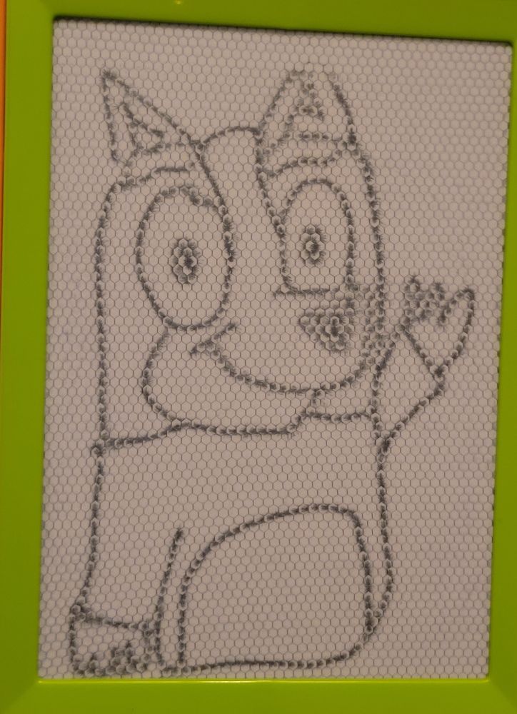 A really bad drawing of Bingo Heeler from the kids show 'Bluey', who is meant to be a red heeler puppy. The drawing is done on a magnetic drawing pad for children.