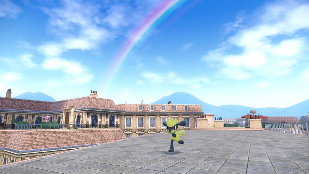 Shiny riolu running on a rooftop with a rainbow in the background