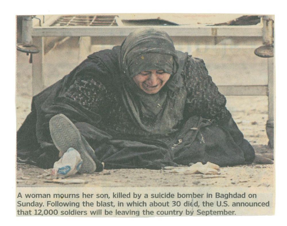 A woman mourns her son, killed by a suicide bomber in Baghdad on Sunday. Following the blast, in which about 30 died, the U.S. announced that 12,000 soldiers will be leaving the country by September.