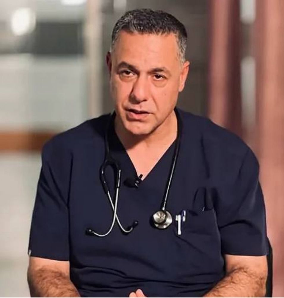 Dr Hussam Abu Safiyeh in scrubs.