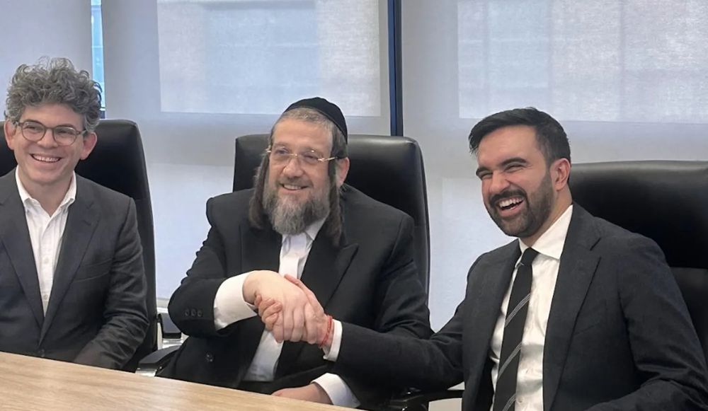 Zohran Mamdani, right, shaking the hand of Rabbi Moshe Indig of the Satmar Hassidic community on Sunday.