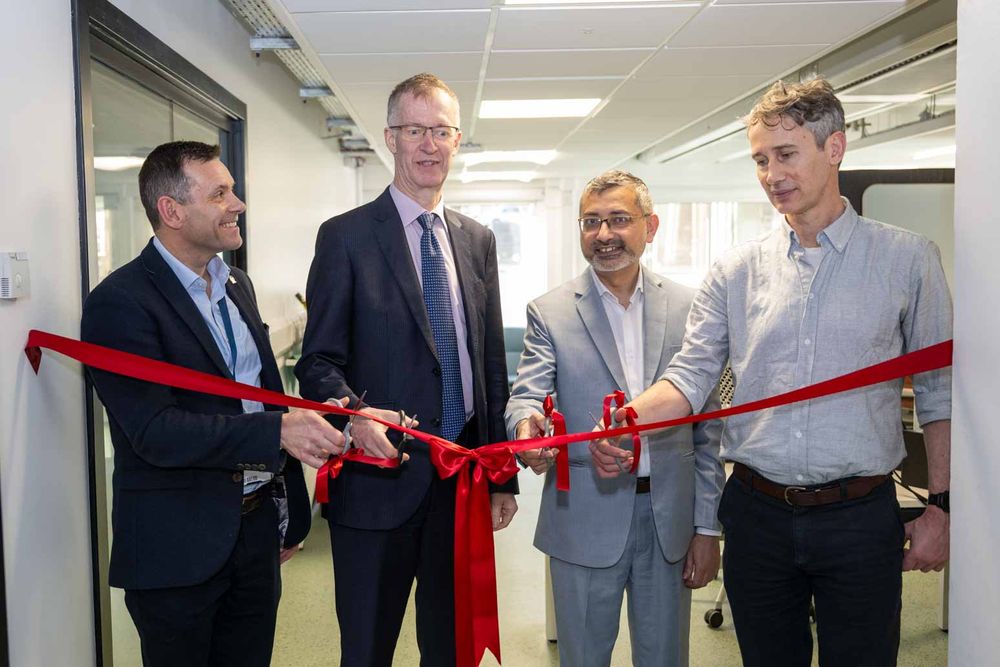 A red ribbon is cut at the opening ceremony of the University of Glasgow's new medical magnetics research facility