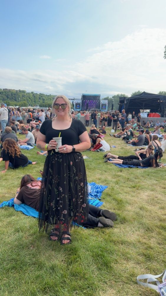 Me in a floral skirt at a Hozier concert 