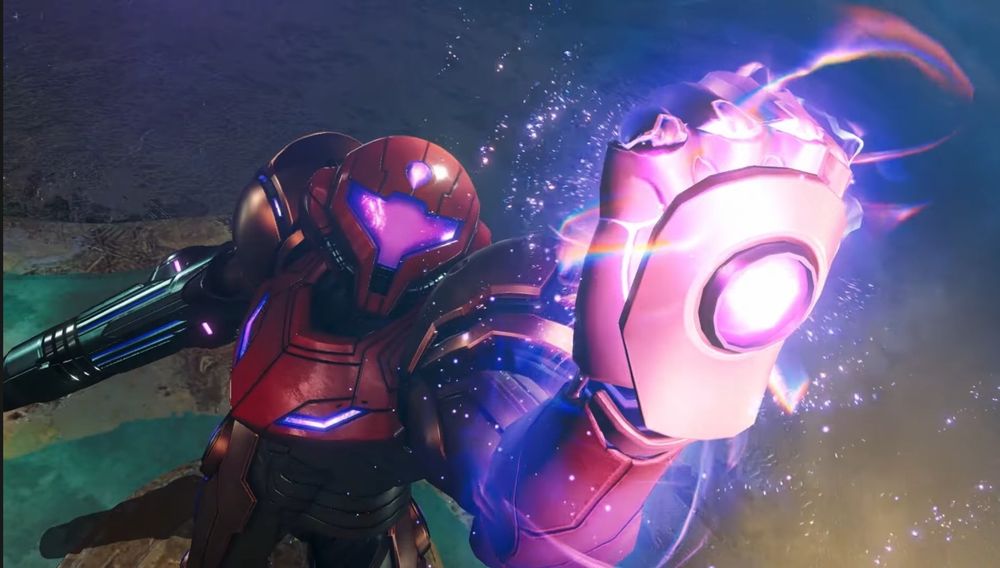 Image de Samus Aran de la saga Metroid serrant son poing au premier plan avec une onde d’énergie 