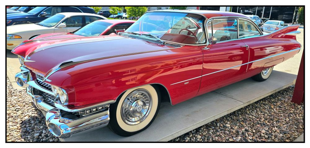 A red 1959 Cadillac Coupe DeVille on display at the Automobile Gallery and Event Center in Green Bay, Wisconsin.