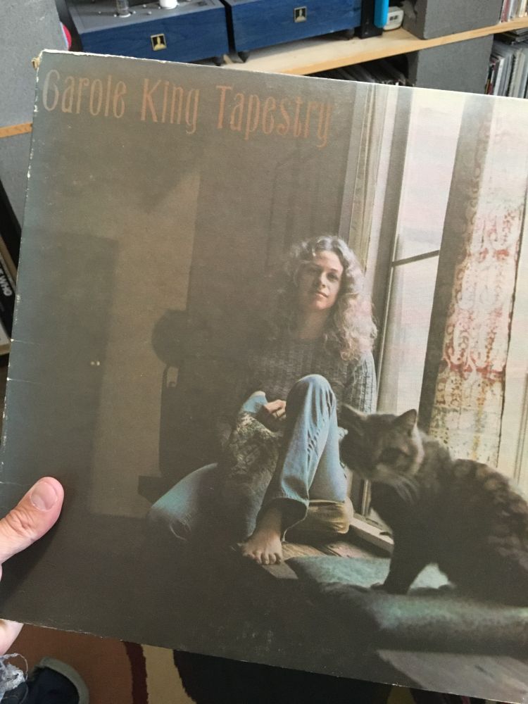 A record of the Carole King album Tapestry being held by my left hand