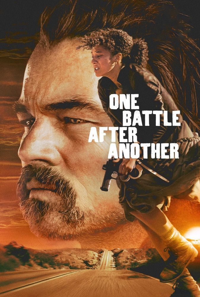 A poster for the live action movie One Battle After Another. Bob is a white nab with short dark hair and a mustache. Most of the poster is dominated by a close up of his head staring toward the left. On the right side, his daughter Willa stands, hunched over and clutching a gun and handcuffs. She is a young woman with light brown skin and curly brown hair. At the bottom of the poster is a long desert road. The title floats over Willa’s torso in bold white letters.