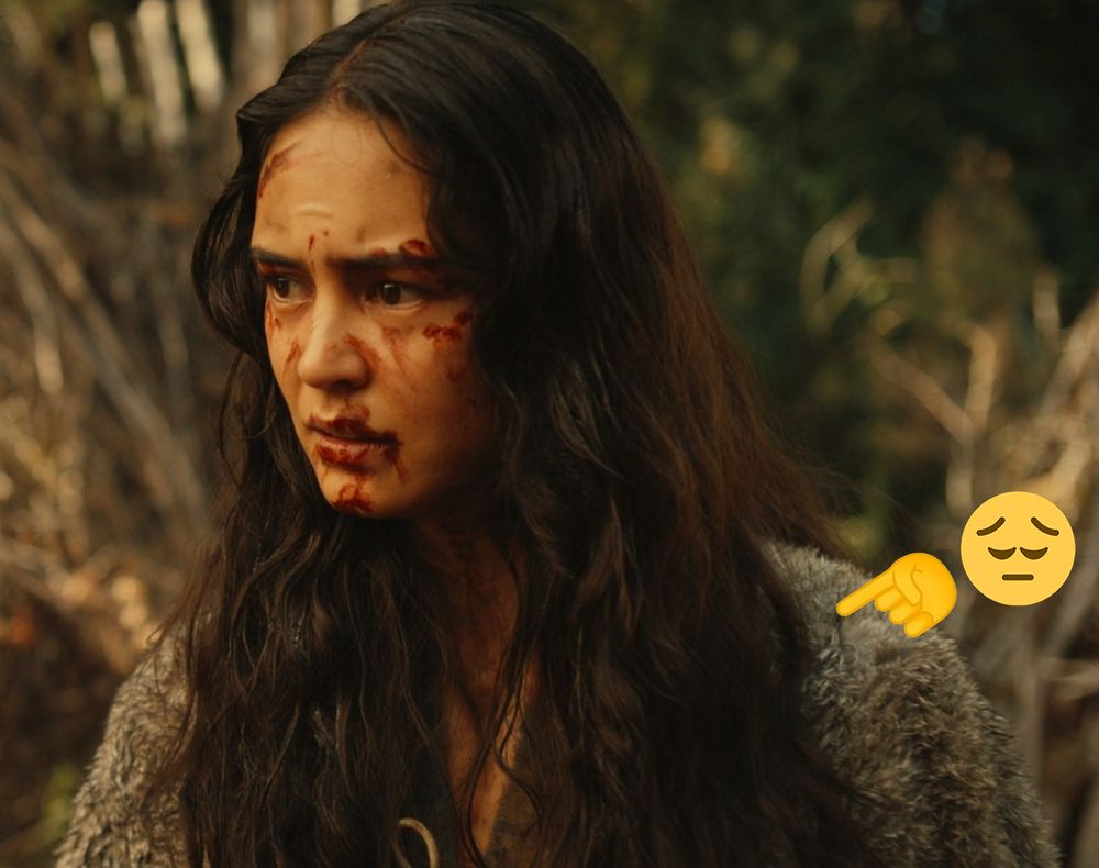 yellowjackets 3x08: teen lottie with blood on her face wearing gray fur over her shoulders. the fur is pointed out by a sad emoji