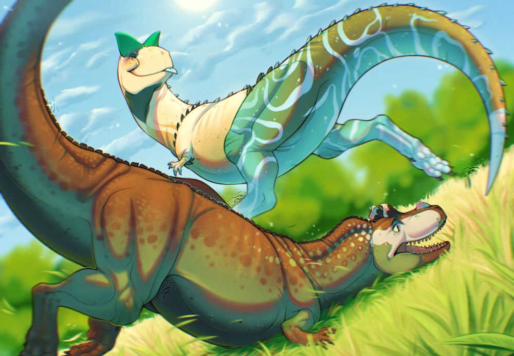 A young carnotarus dodges out of the way of his brother's grasp in a game of tag. They are playing in a field of grass.