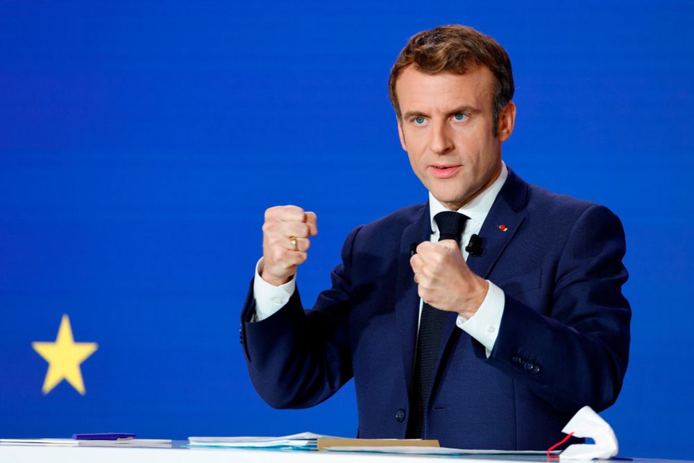 Macron making a fist