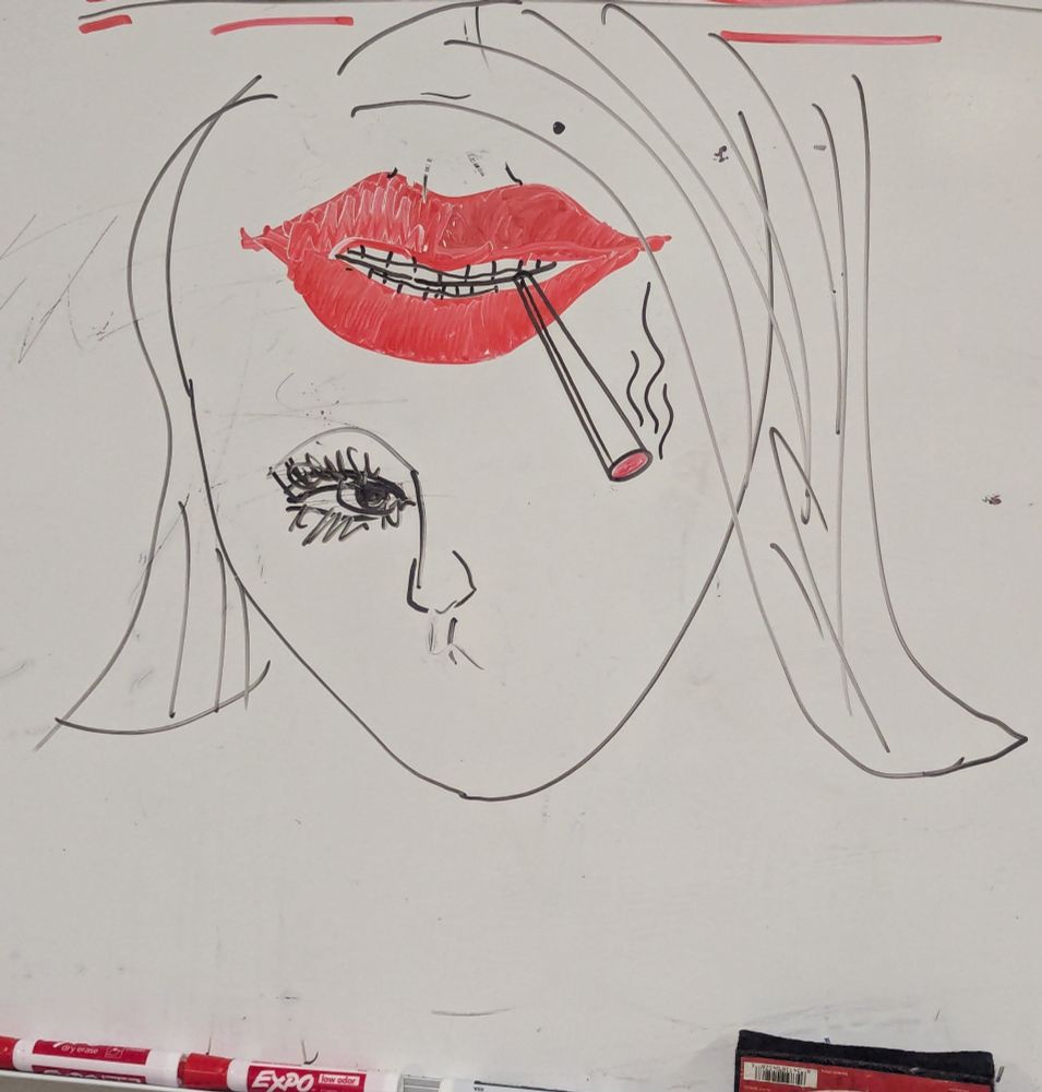 Drawing of a girl's face, except there's only one eye, and the mouth is where the forehead should be